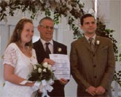 Holly and David with the guy and the certificate